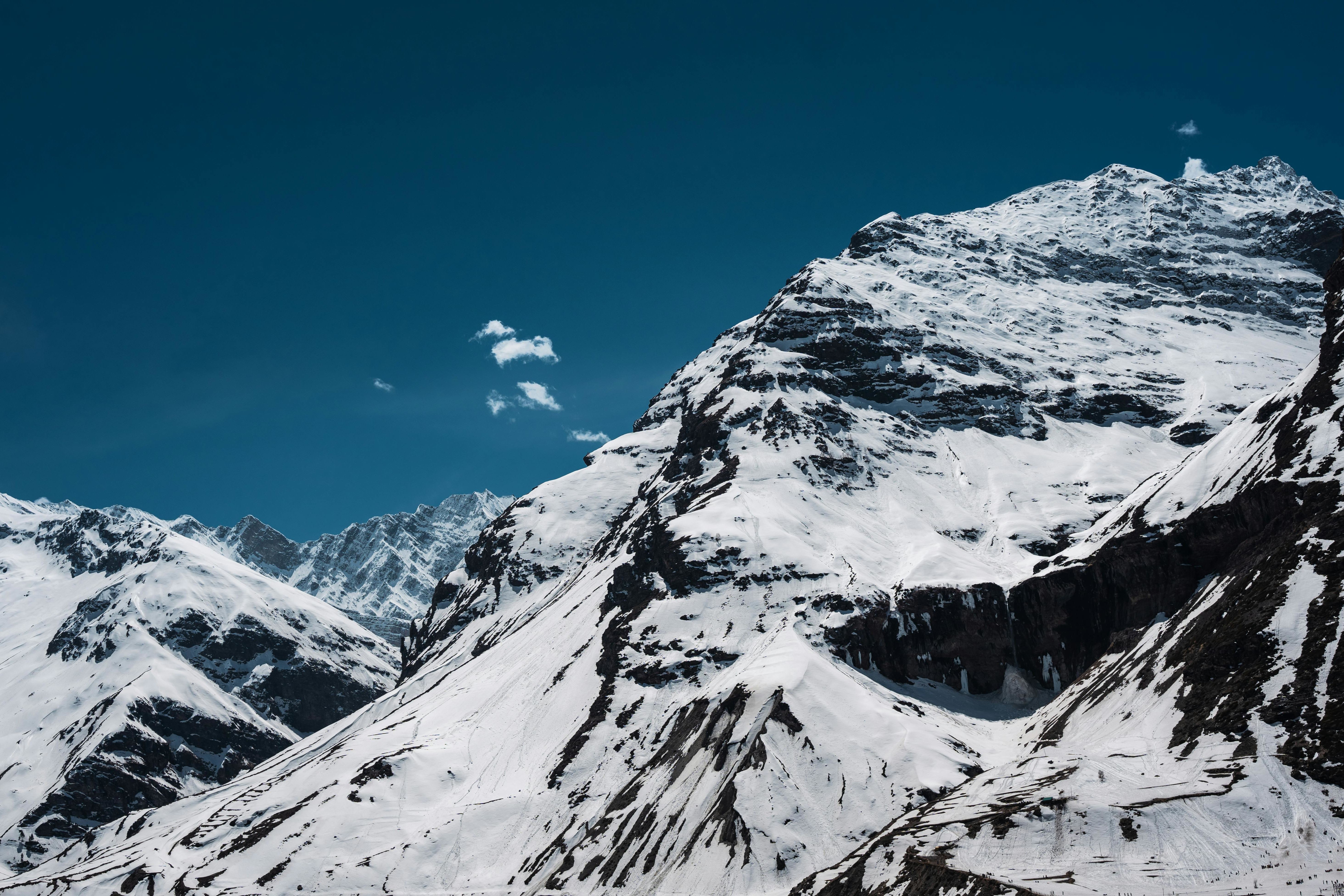 snow covered mountain under blue sky in sissu