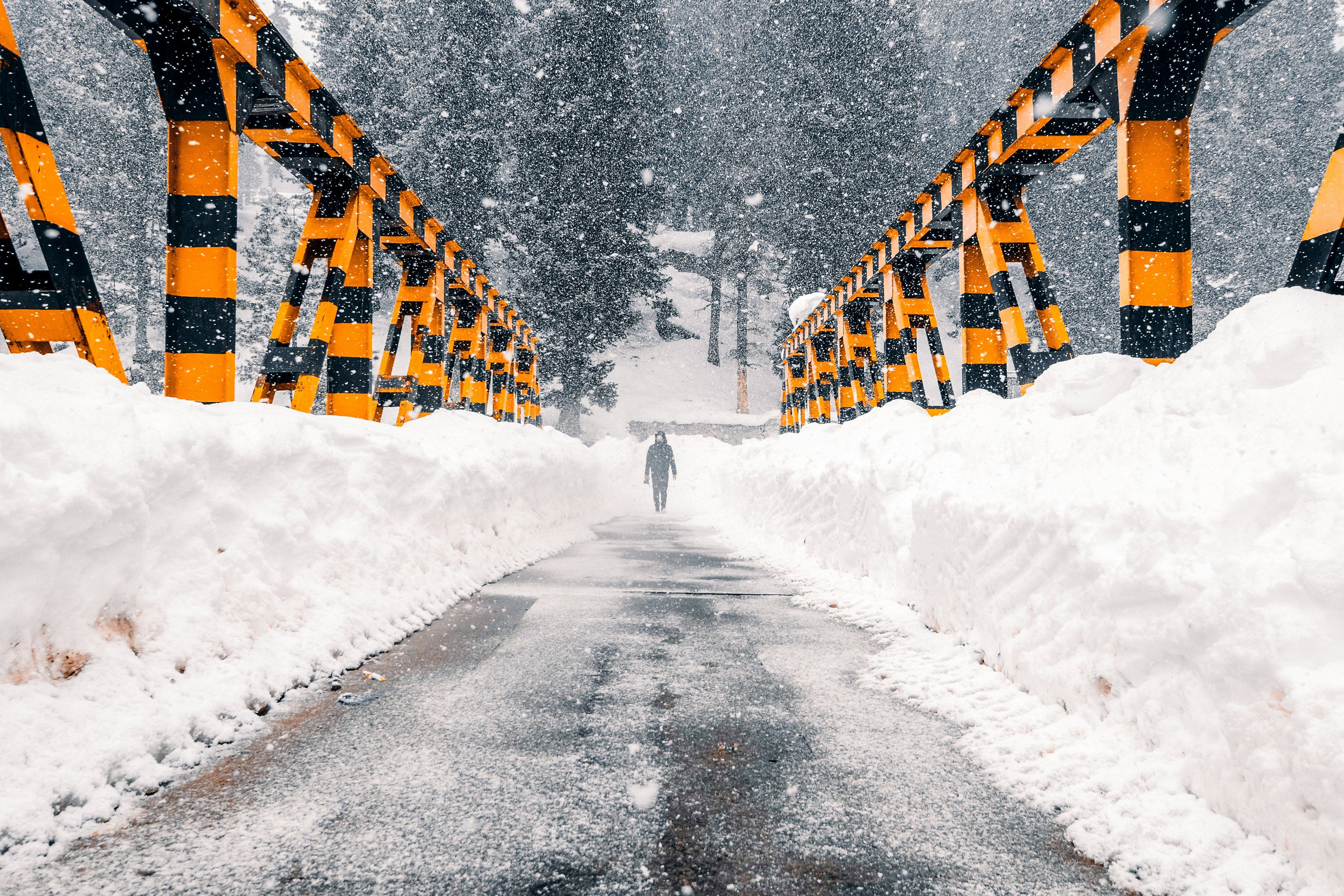snow covered road near drang during daytime