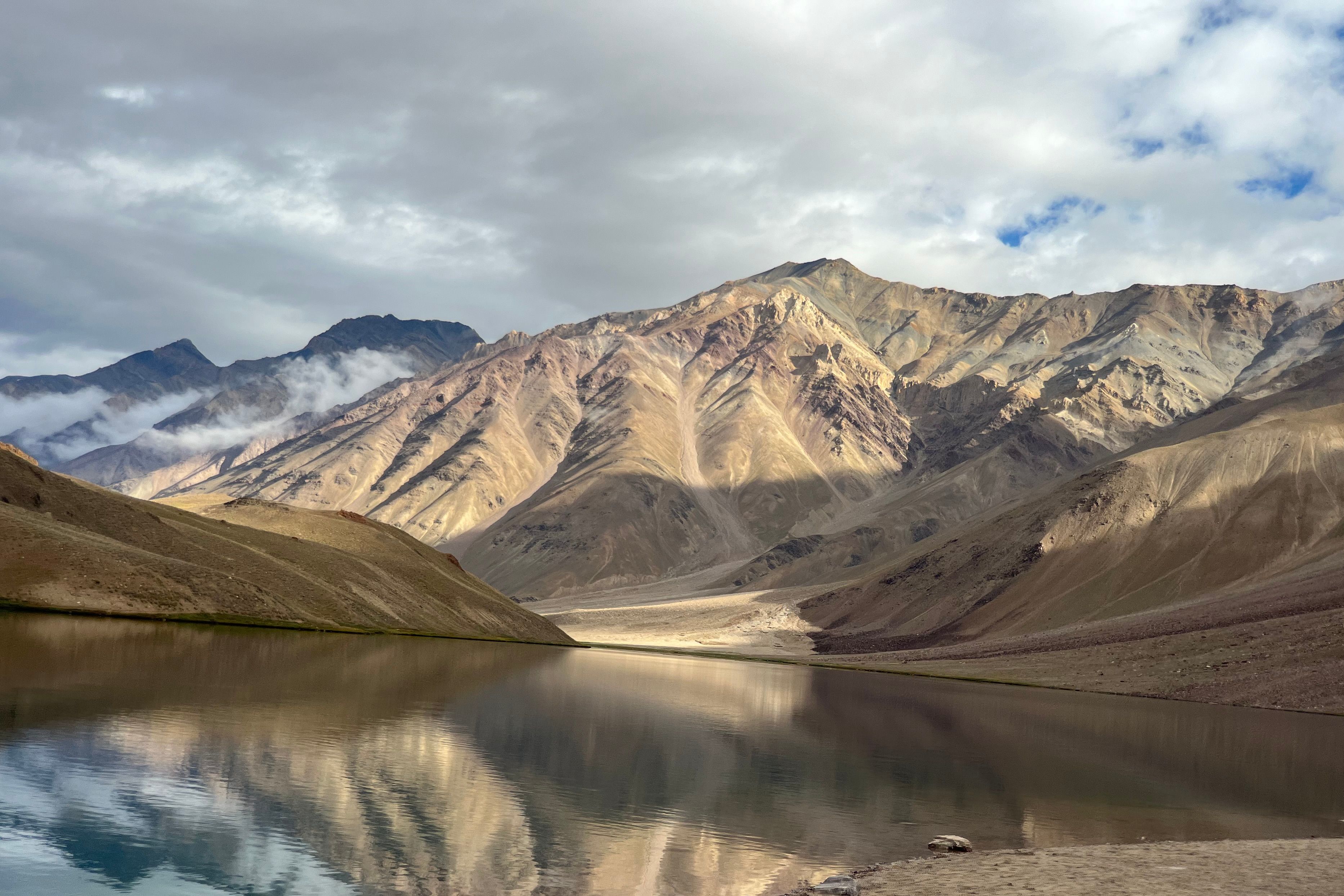 stunning mountain reflection in chandratal lake at spiti valley in himachal pradesh