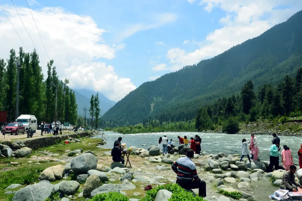 group of tourists near lidder river in pahalgam