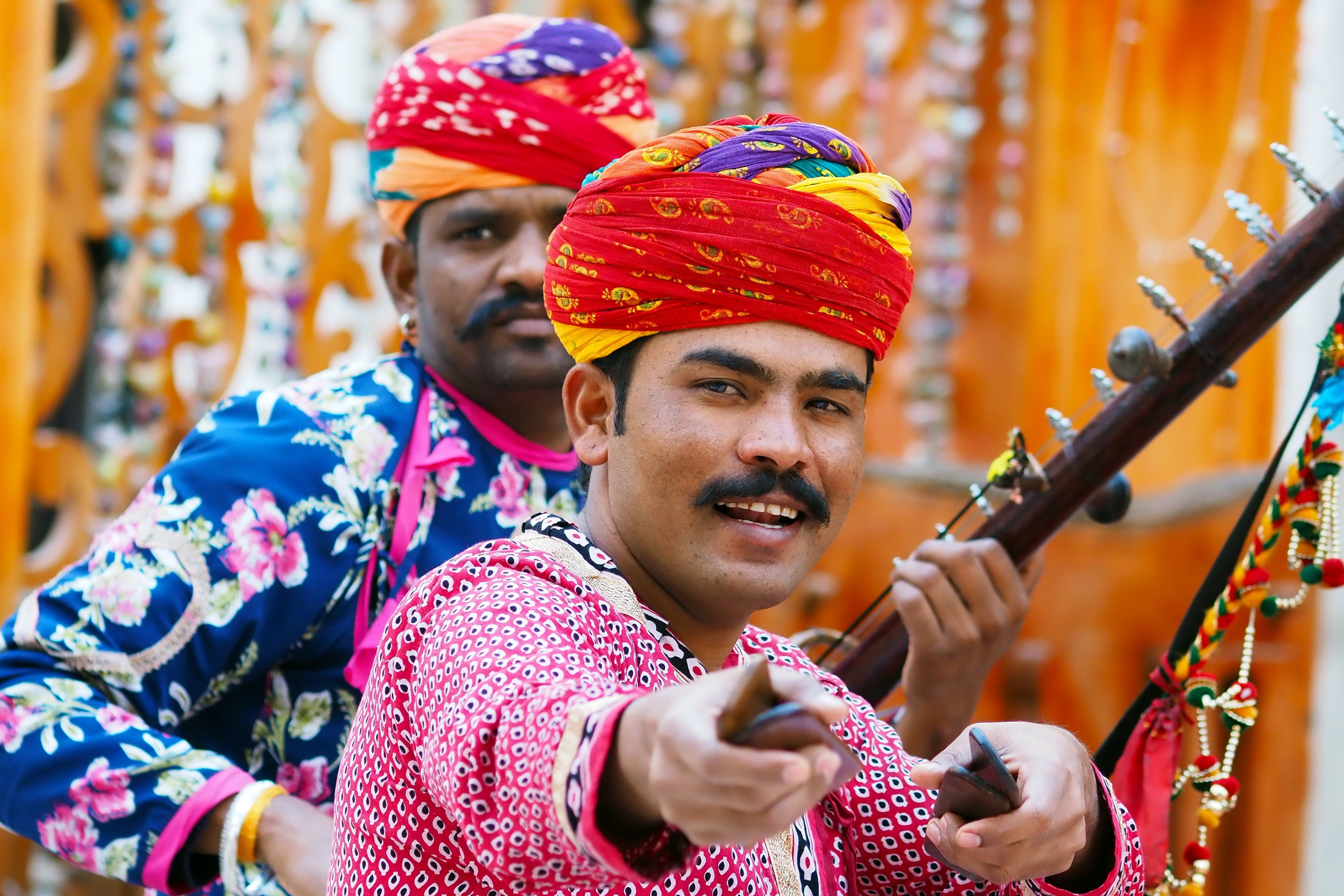 traditional rajasthani musicians playing folk music with vibrant costumes and musical instruments