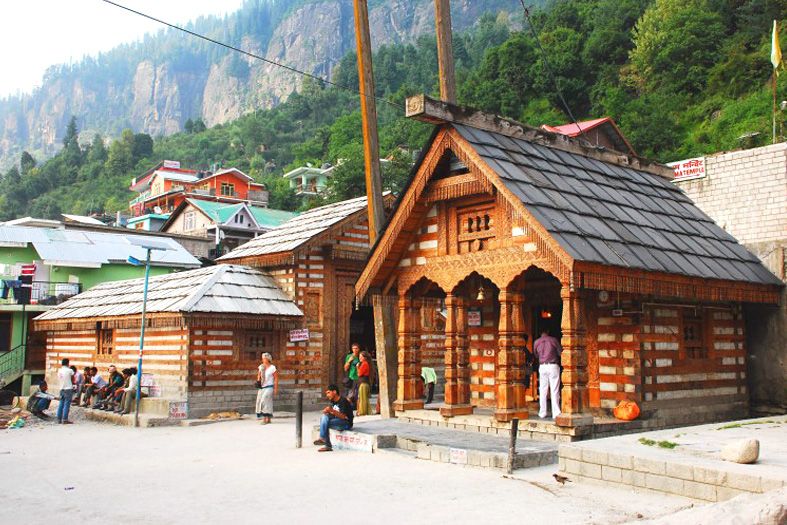 people standing near vashisth temple in manali