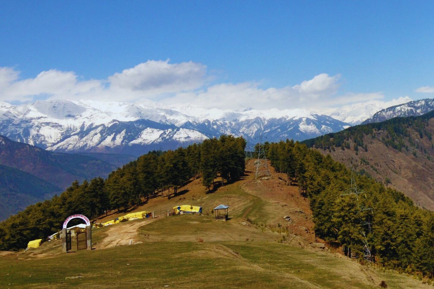 snow covered mountains near bijli mahadev temple