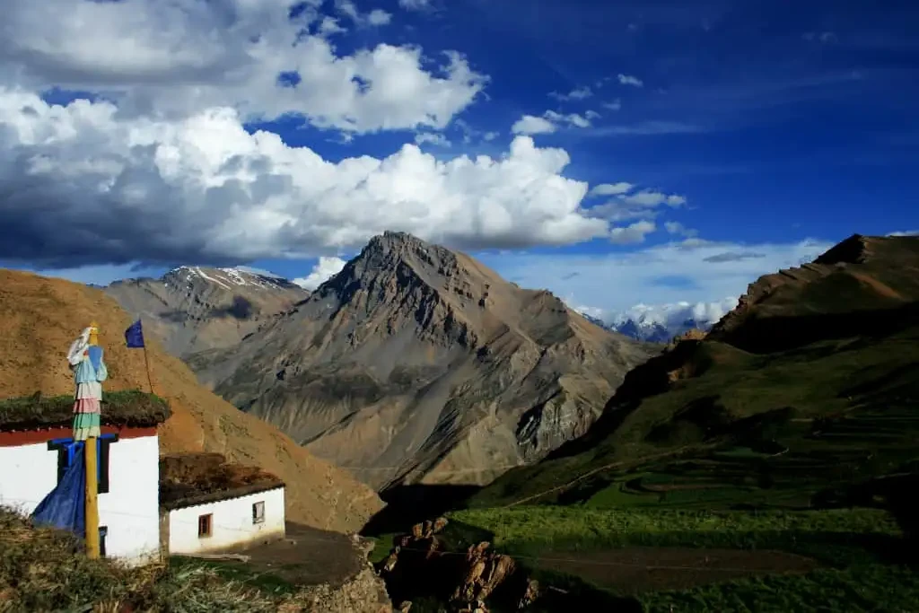 view of tradition house with brown mountain in the backdrop in demul village of spiti valley