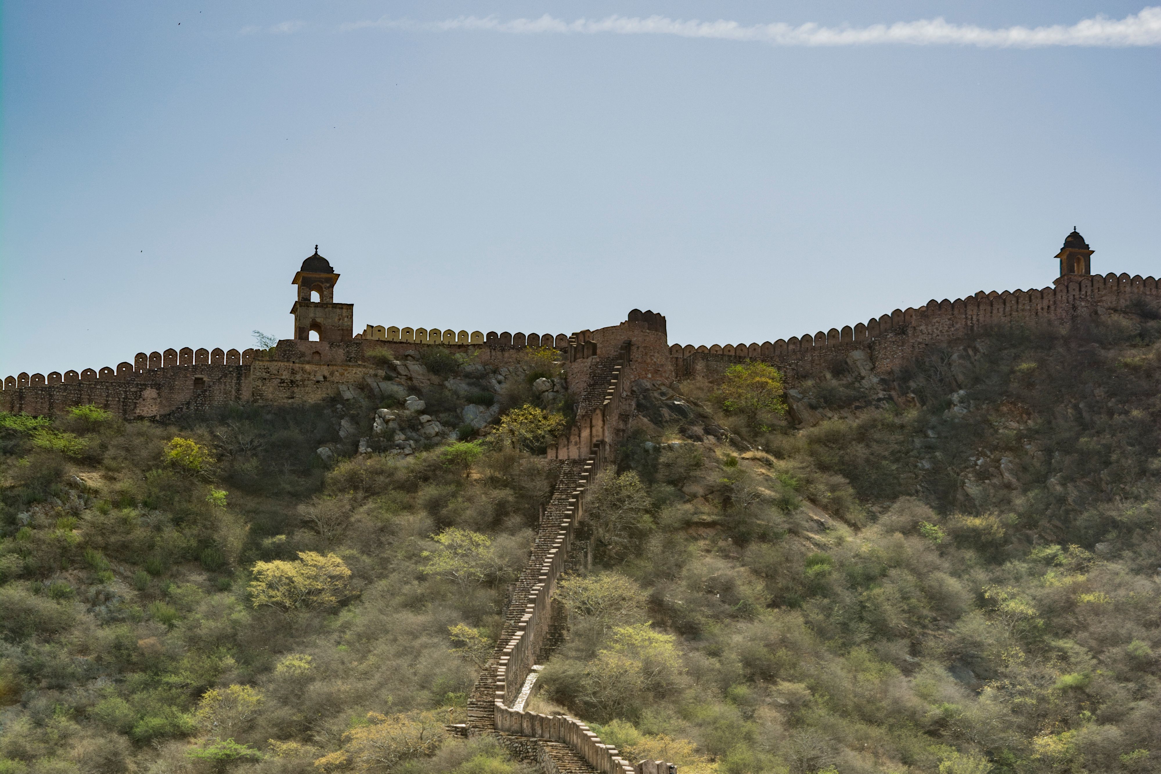 view of jaigarh forts historic wall stretching across the aravalli hills in jaipur india