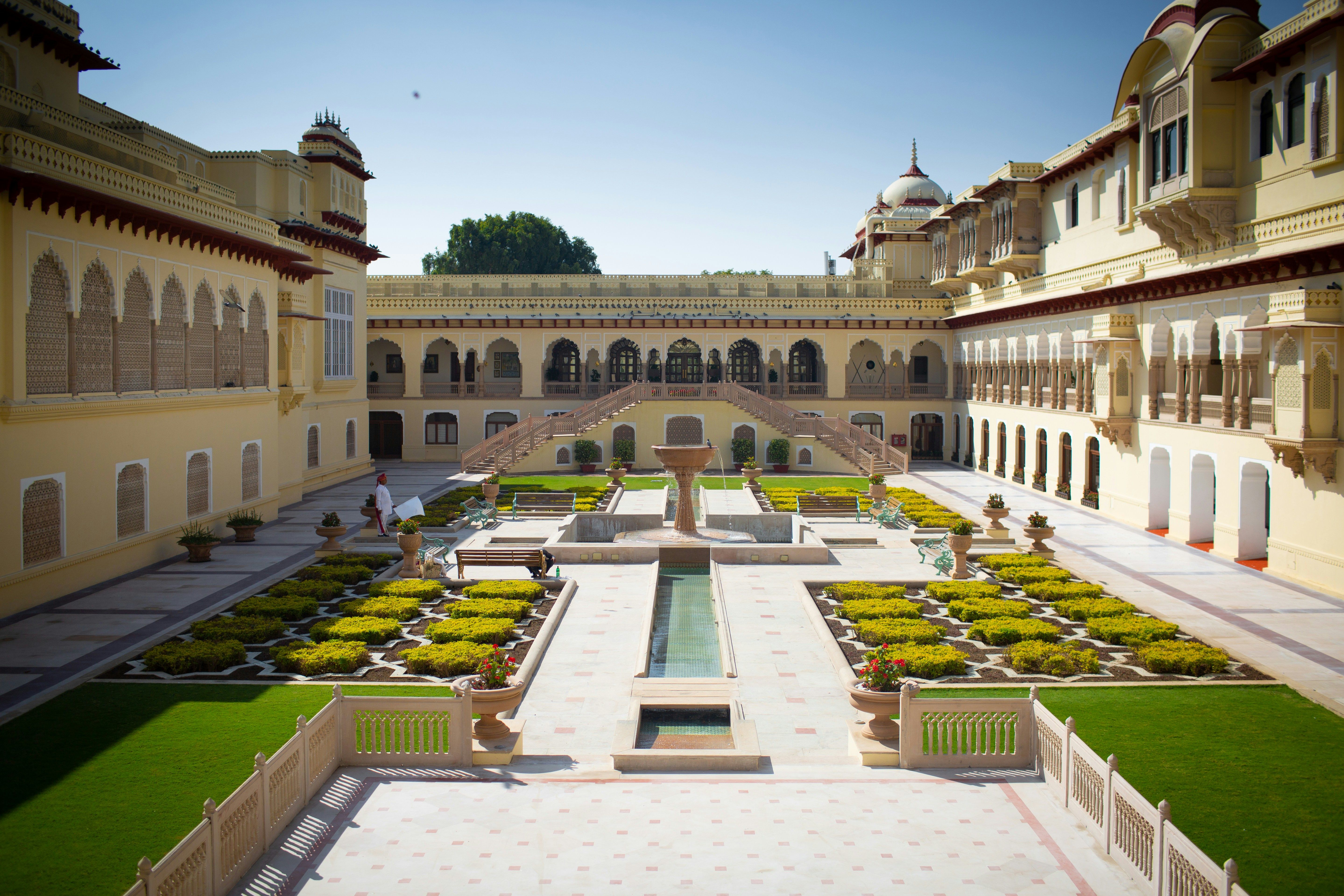 view of inner courtyard of the rambagh palace hotel in jaipur