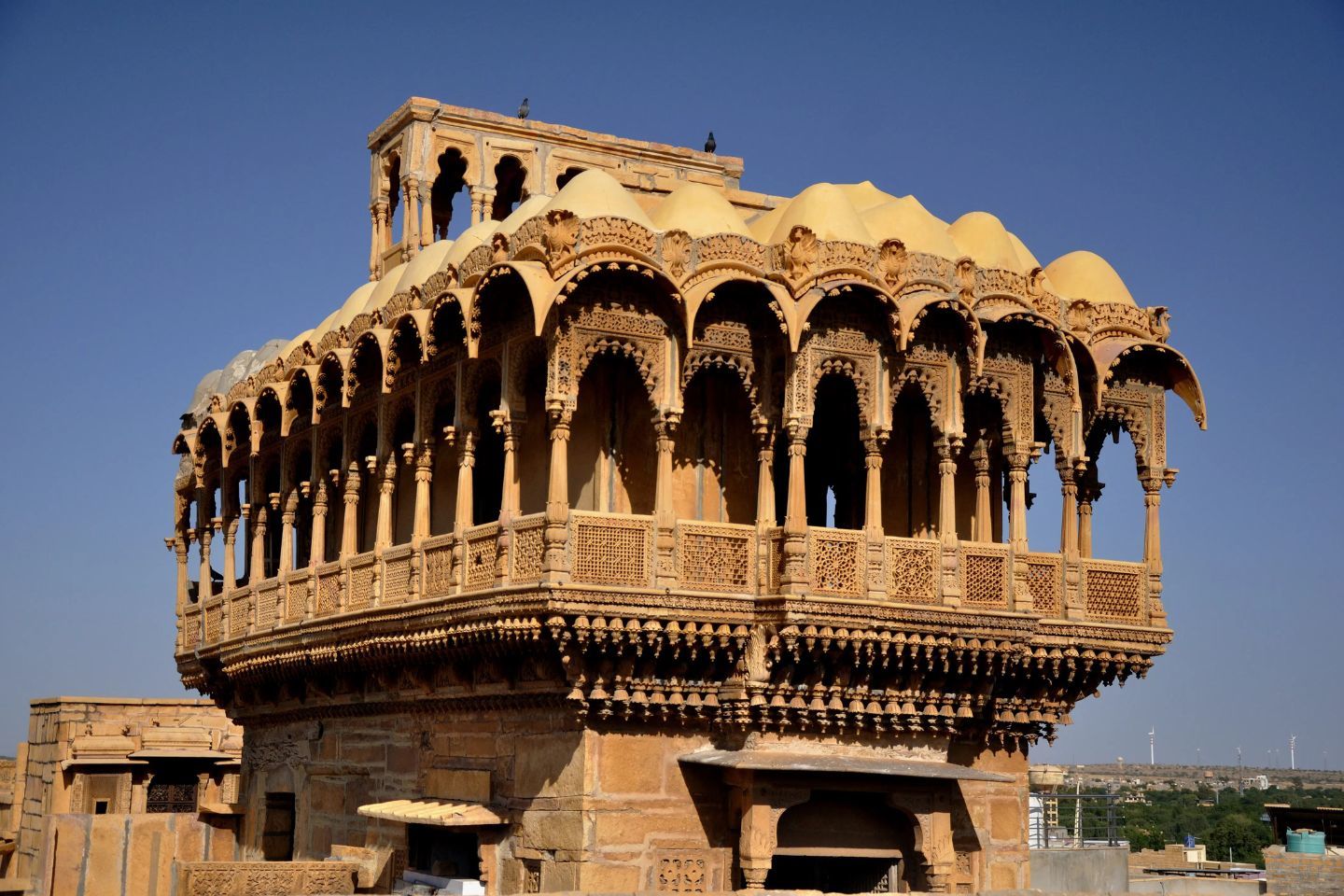 majestic view of the salim singh ki haveli at jaisalmer with clear blue sky in the backdrop