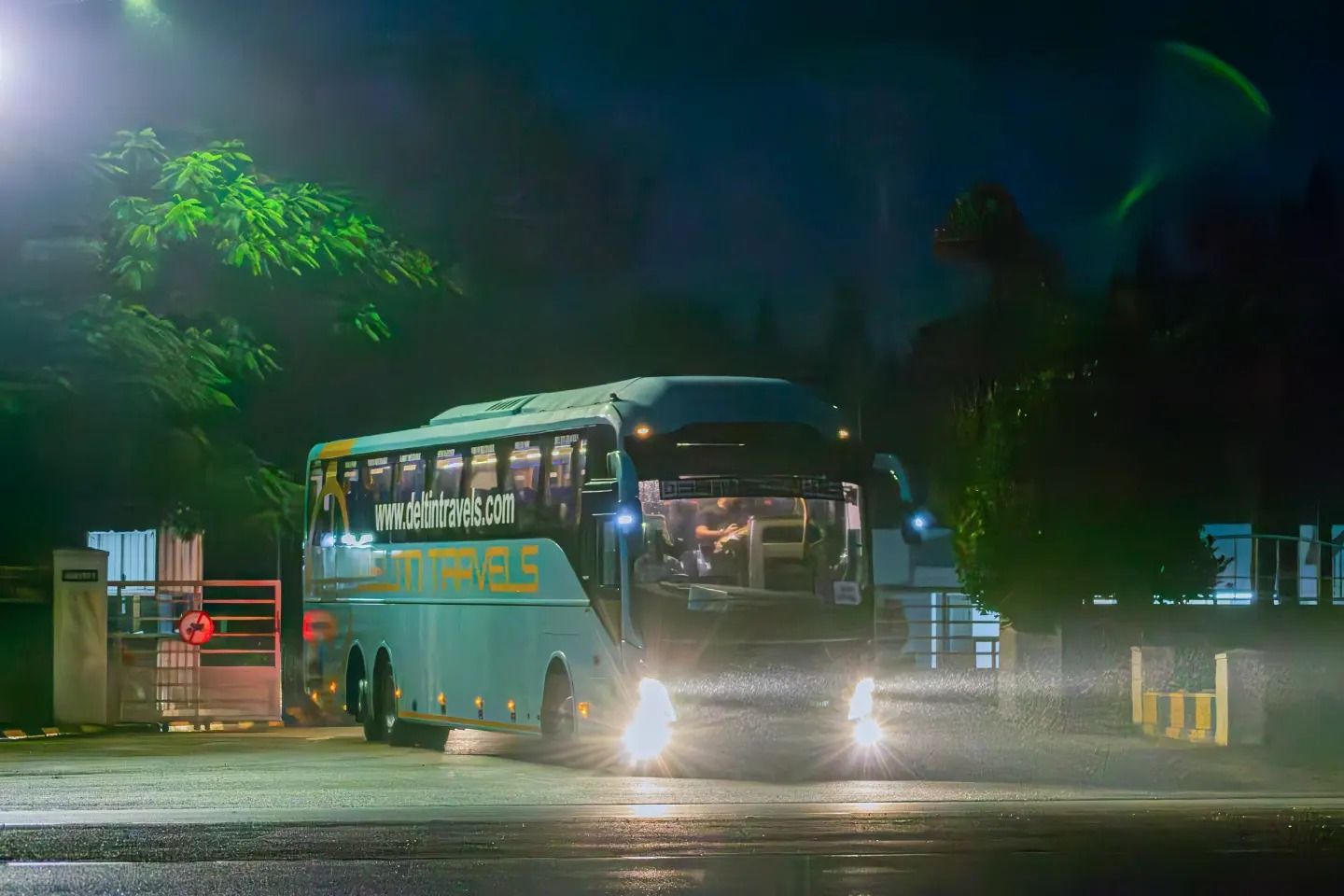 a volvo bus on road travelling between delhi and manali