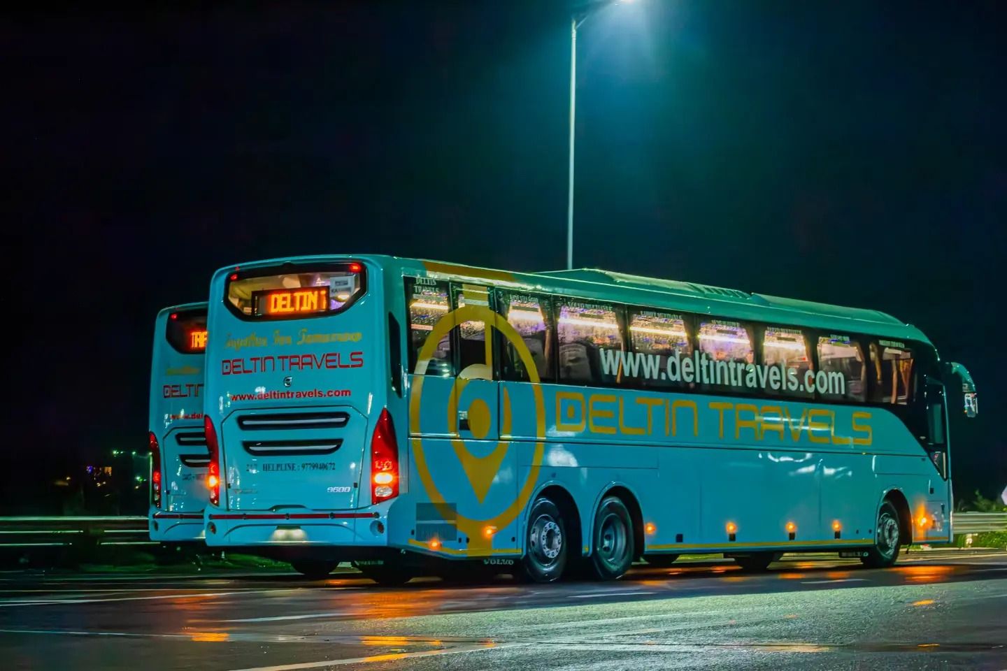two volvo buses on road travelling between delhi and manali