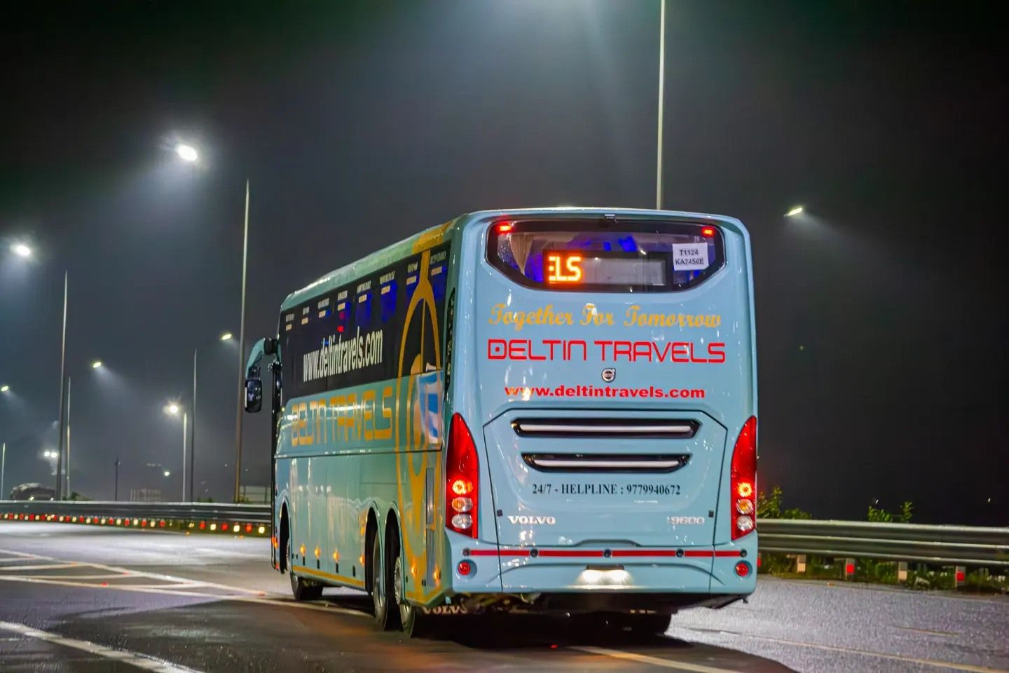 a volvo bus on road travelling between delhi and manali
