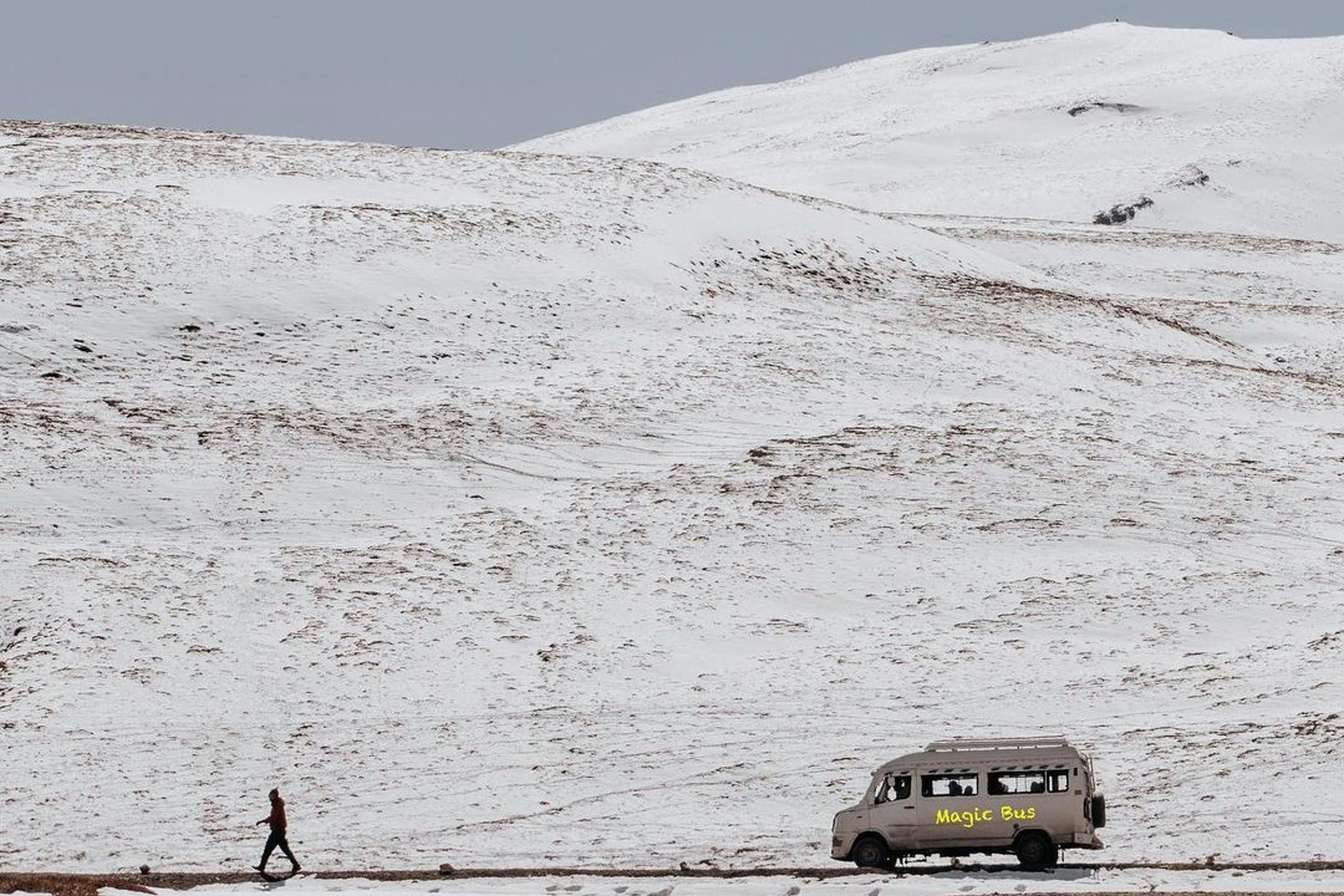 white vehicle on a snow covered field